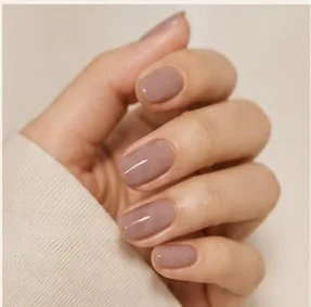 Gel nails in a muted lilac-grey tone