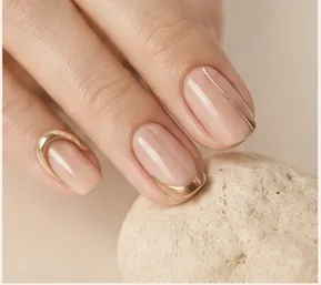 Nails with hand-painted gold line detail